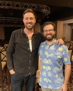Jacob Guidry posing with fellow comedian after live stand-up comedy event